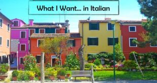 Colorful houses from the island of Burano outside of Venice with park bench out front for Conversational Italian