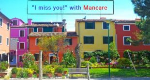 Italian homes with a park bench in front where people can sit and talk about who they miss in Italian using the verb mancare.