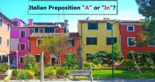 Sidewalk bench in front of Italian homes where Italians converse using prepositions "a" and "in"